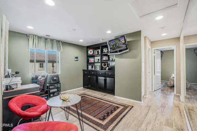 a room with furniture and wooden floor