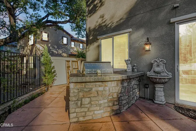 a spacious bathroom with a granite countertop sink and a mirror