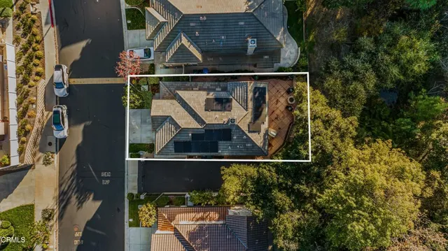 an aerial view of a residential apartment building with a yard