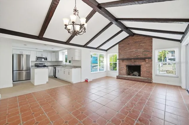 a view of a kitchen with furniture and a fireplace