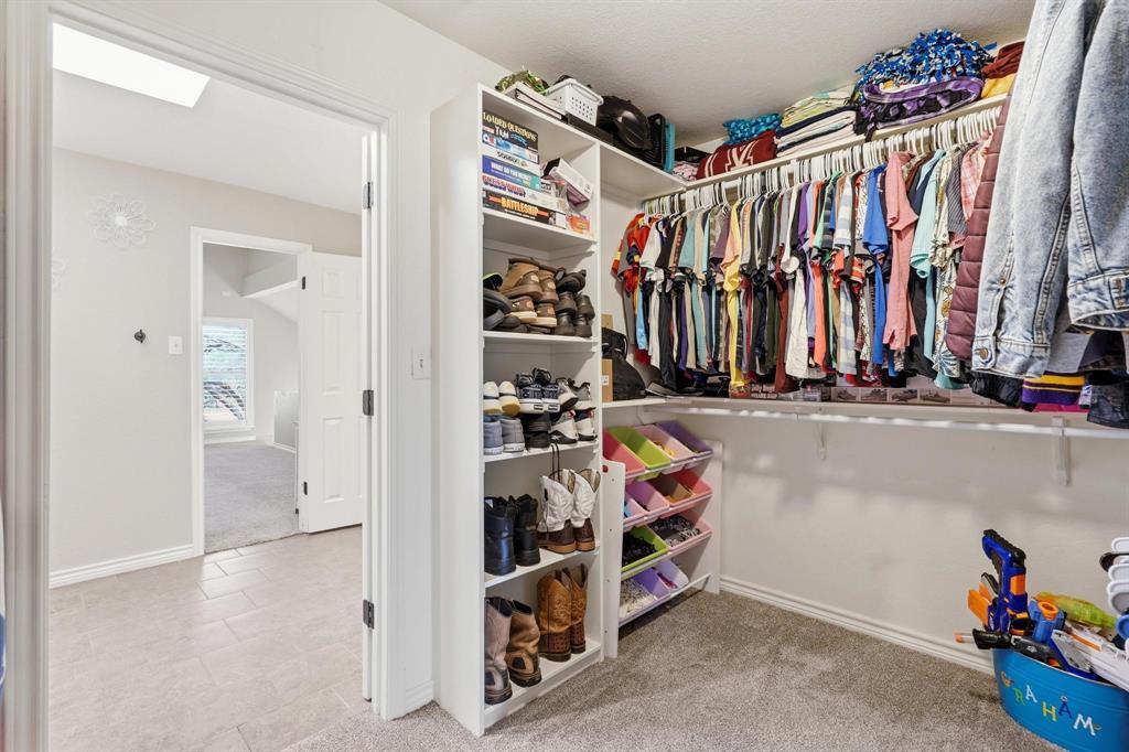 432 Clark Road Abilene, TX 79602 - Photo 31 of 40 a view of walk in closet with clothes and shoes