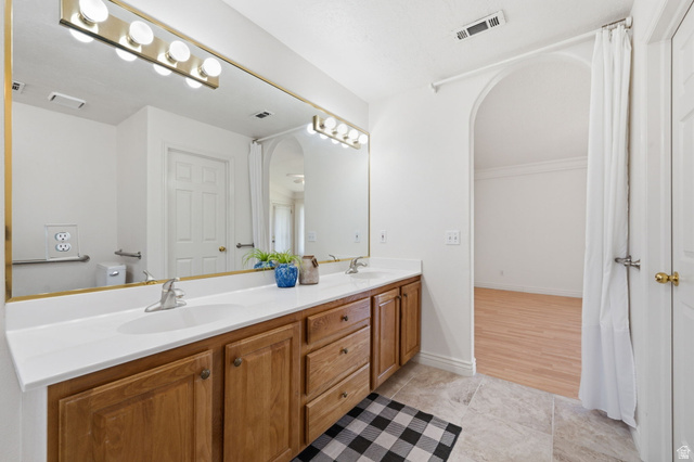805 South River Road, Unit 70 St. George, UT 84790 - Photo 20 of 38 Dual vanity with light wood-finish cabinetry and white countertops