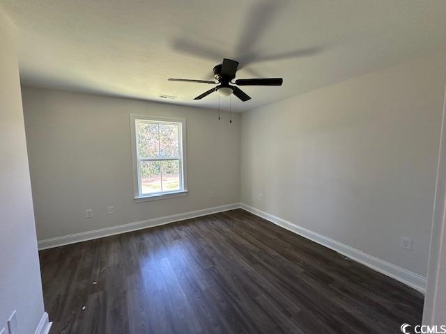3393 Dusty Road Loris, SC 29569 - Photo 11 of 15 Empty room featuring ceiling fan and dark hardwood