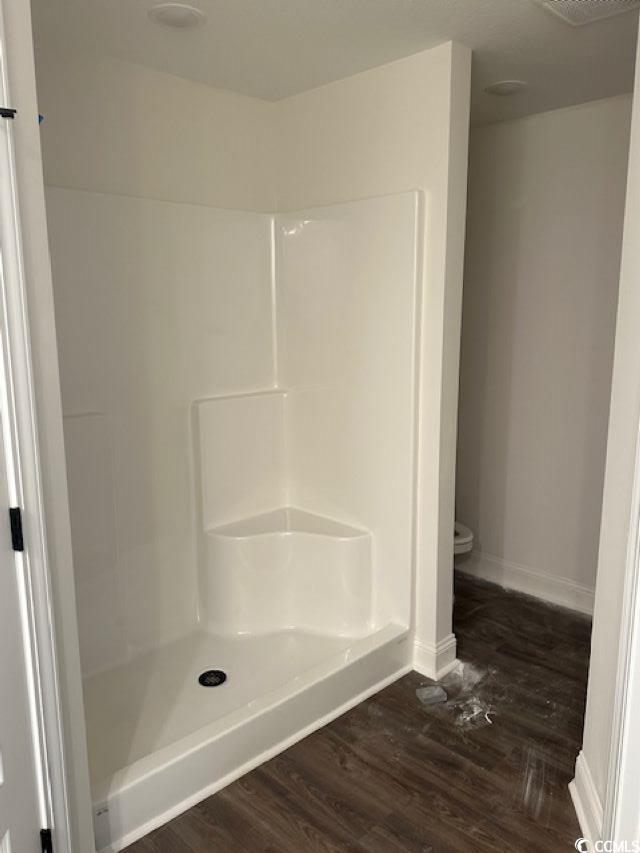 3393 Dusty Road Loris, SC 29569 - Photo 13 of 15 Bathroom with toilet, hardwood / wood-style floors