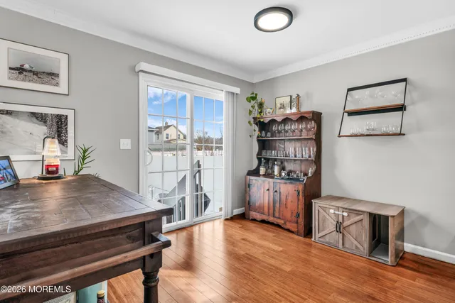 a living room with furniture gym equipment and a flat screen tv