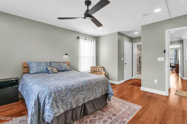 a front view of a house with a tree