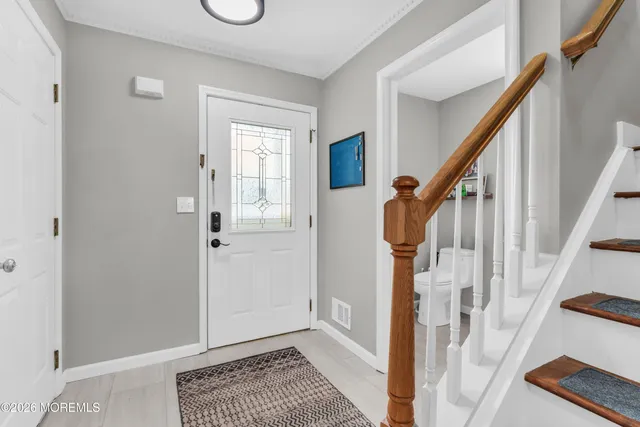 a kitchen with stainless steel appliances granite countertop a refrigerator stove and a sink