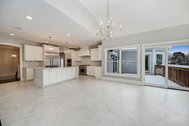 a view of a kitchen with a sink and cabinets