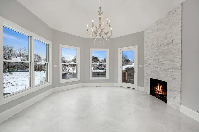 a view of livingroom with window fireplace and window