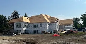 a group of cars parked in front of a house