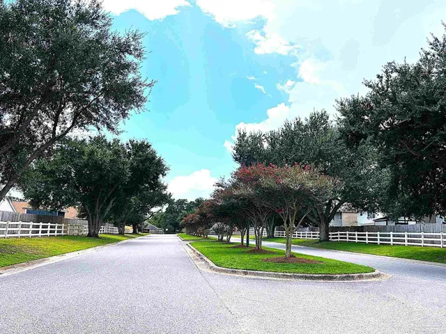 a view of a playground with basketball court