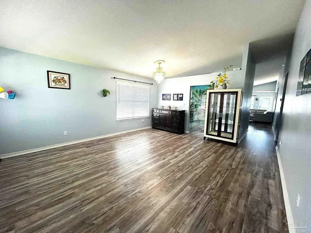 a view of a livingroom with wooden floor