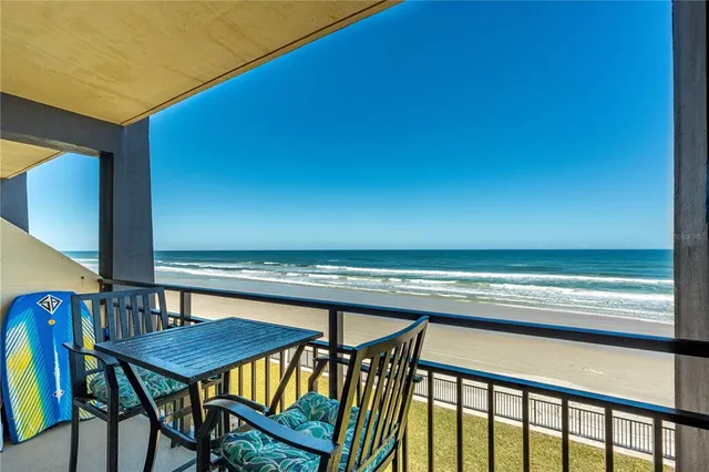 a view of a balcony with chairs