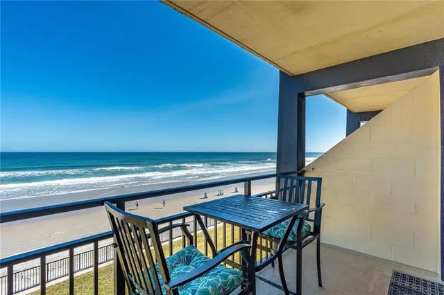 a view of dinning table and chairs in patio