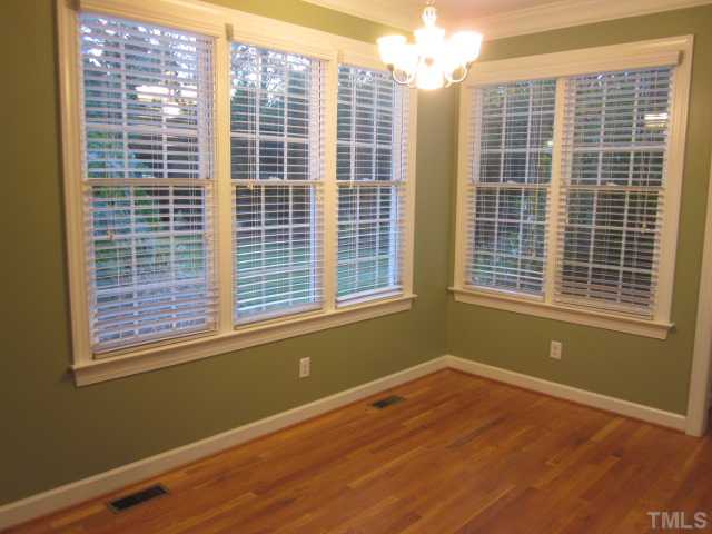 10024 Baileywick Road Raleigh, NC 27613 - Photo 16 of 25 Nice view of the breakfast area with great views of the backyard! First floor hardwoods & crown molding, updated lights & ceiling fans! Newer carpet!