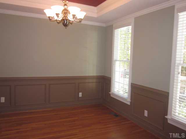 10024 Baileywick Road Raleigh, NC 27613 - Photo 19 of 25 Formal dining room features hardwood floors and crown molding! Great space when entertaining family and friends during the holidays!