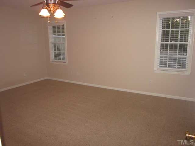 10024 Baileywick Road Raleigh, NC 27613 - Photo 20 of 25 Lovely master bedroom features a ceiling fan with light kit! Great home in fantastic location! Rare find property with over an acre of land!