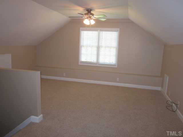 10024 Baileywick Road Raleigh, NC 27613 - Photo 25 of 25 This is the third floor bonus room! Could be used as a bedroom, exercise room along with an office! Ceiling fan and a closet! Built in safe as well!