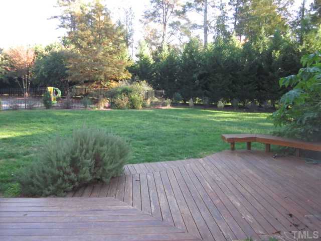 10024 Baileywick Road Raleigh, NC 27613 - Photo 4 of 25 Fabulous two tier deck with wonderful fenced in back yard! Leland cypress trees provide lots of privacy in this wonderful back yard!