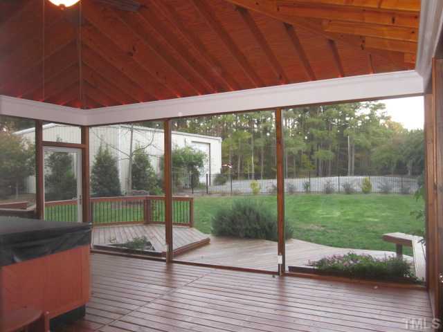 10024 Baileywick Road Raleigh, NC 27613 - Photo 5 of 25 Huge screened porch features vaulted ceilings with bead board, open rafters & cable outlet for TV! Also, rope lighting on screened porch!