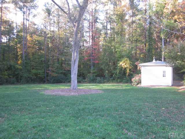 10024 Baileywick Road Raleigh, NC 27613 - Photo 9 of 25 Beautiful back yard with lots of space for the kids or pets to run and play! Hard to find custom home on over an acre of land in great location!