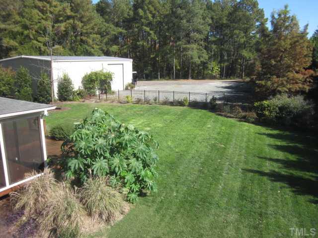 10024 Baileywick Road Raleigh, NC 27613 - Photo 10 of 25 Another wonderful view of the beautiful back yard! Here you can see the 40x50 office/shop/garage off back of home!