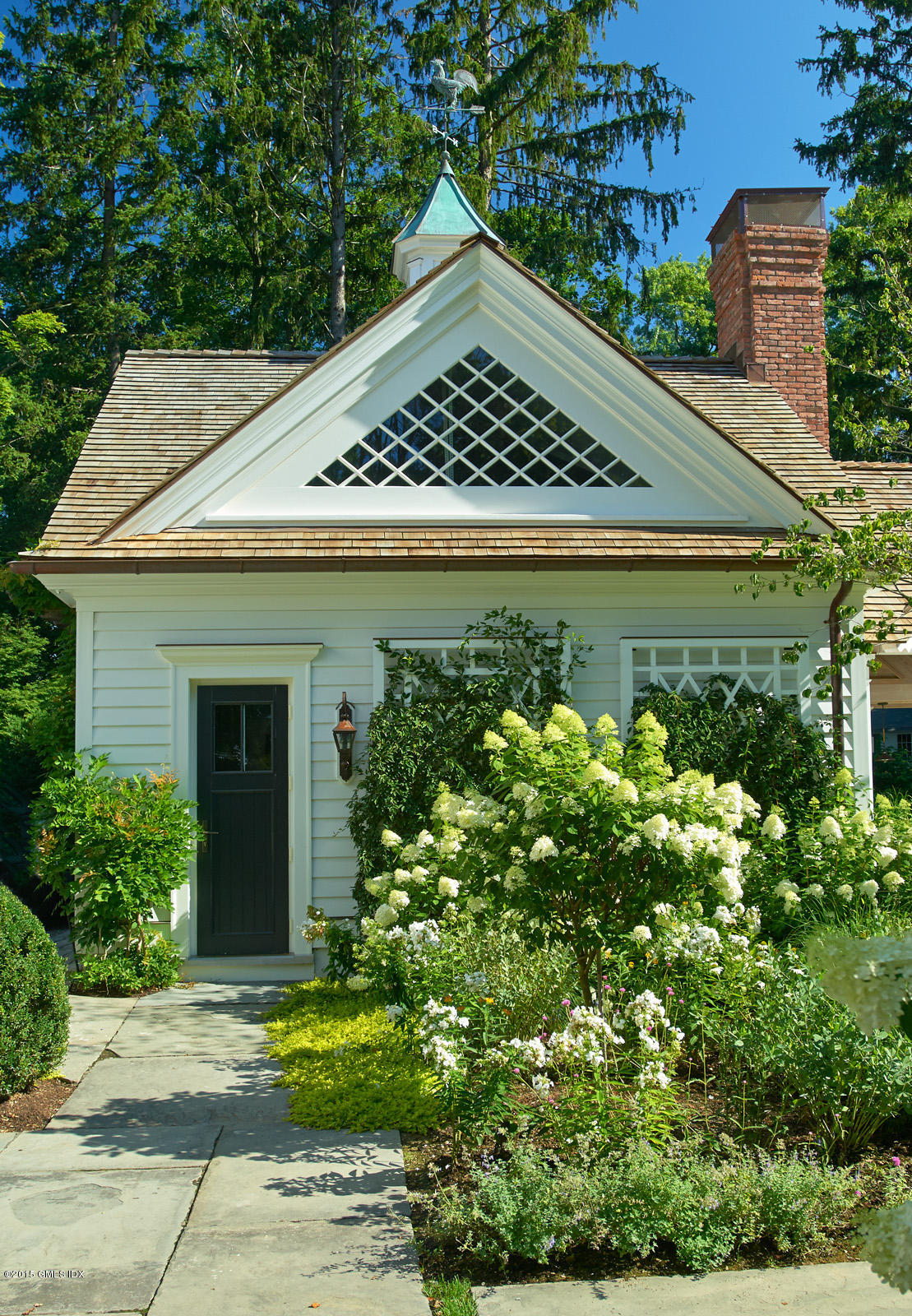 409 Round Hill Road Greenwich, CT 06831 - Photo 15 of 17 a view of a house with a yard