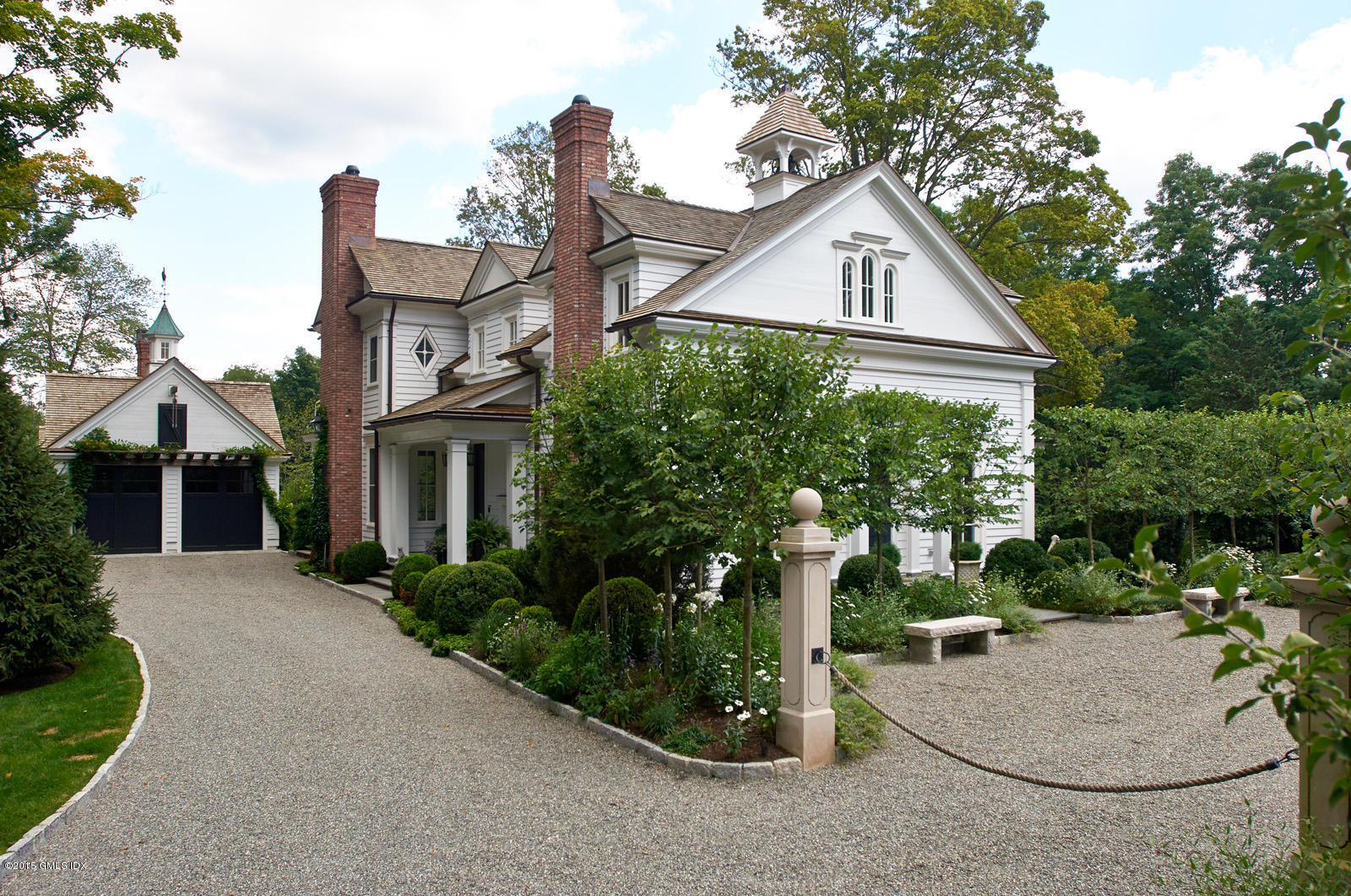 409 Round Hill Road Greenwich, CT 06831 - Photo 2 of 17 a view of a house with yard and plants