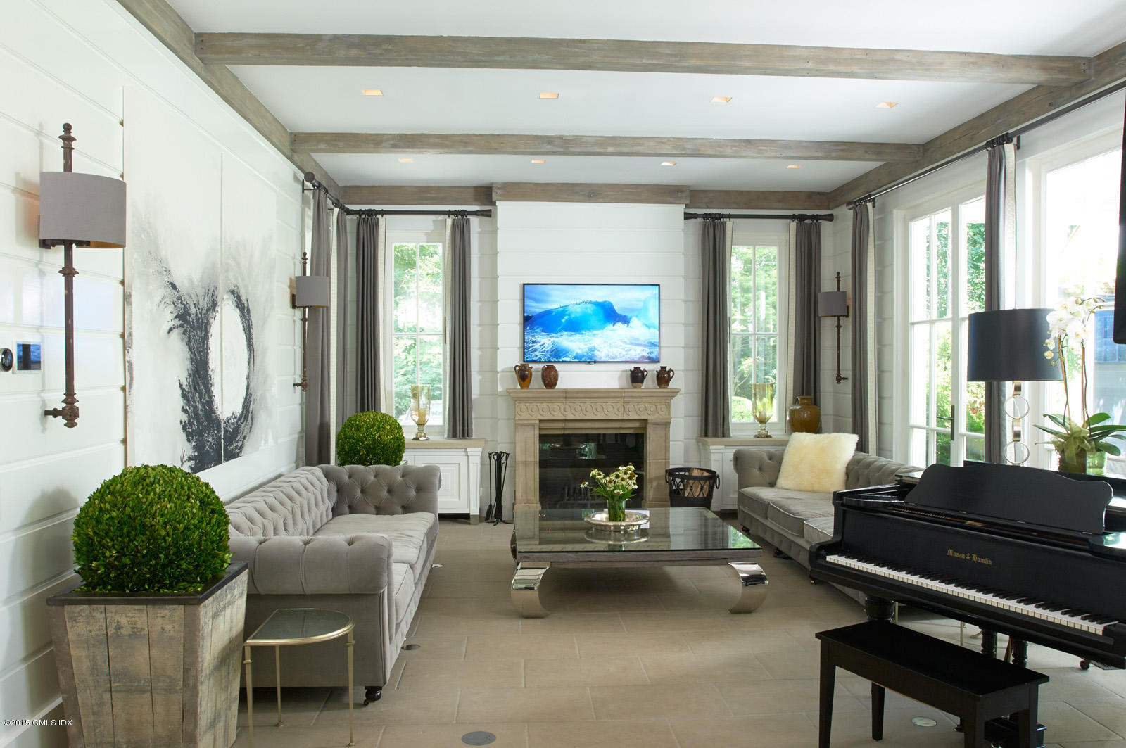 409 Round Hill Road Greenwich, CT 06831 - Photo 5 of 17 a living room with furniture fireplace and a large window