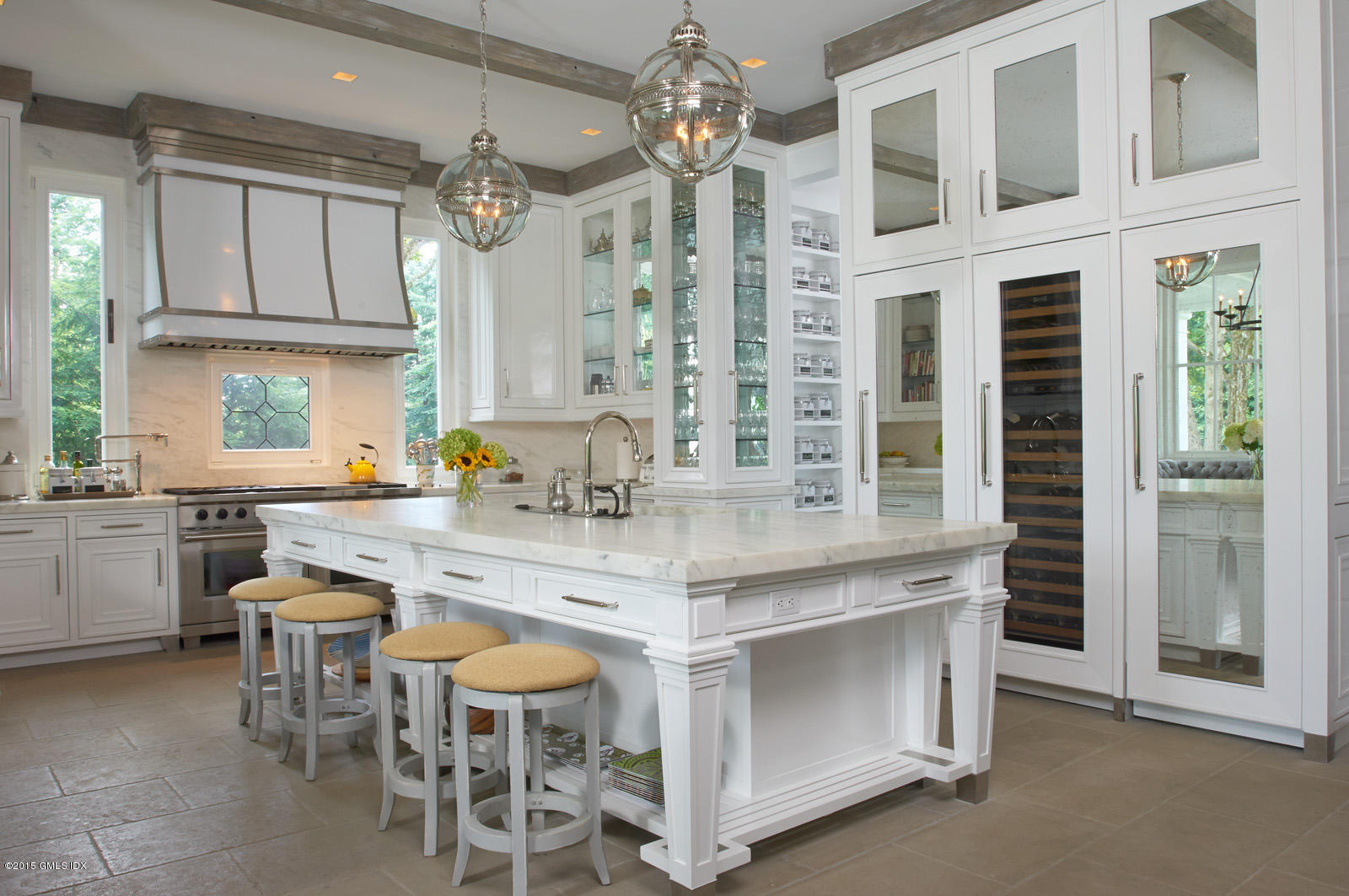 409 Round Hill Road Greenwich, CT 06831 - Photo 6 of 17 a kitchen with cabinets a sink dishwasher a dining table and chairs