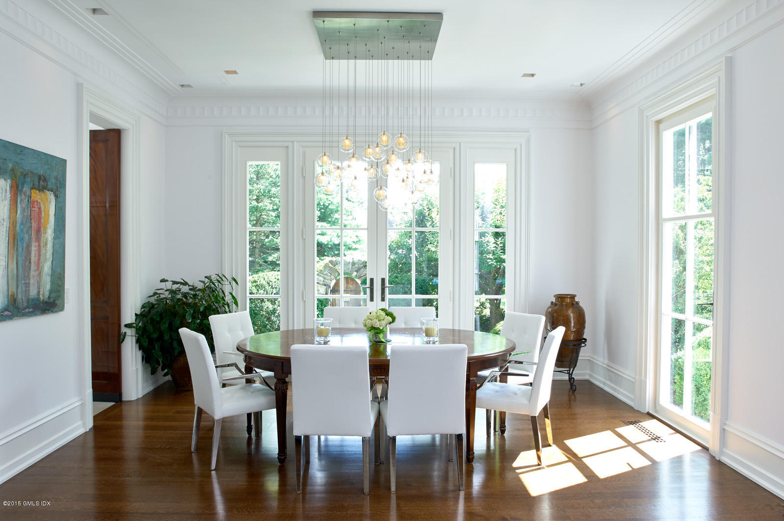 409 Round Hill Road Greenwich, CT 06831 - Photo 9 of 17 a view of a dining room with furniture window and wooden floor