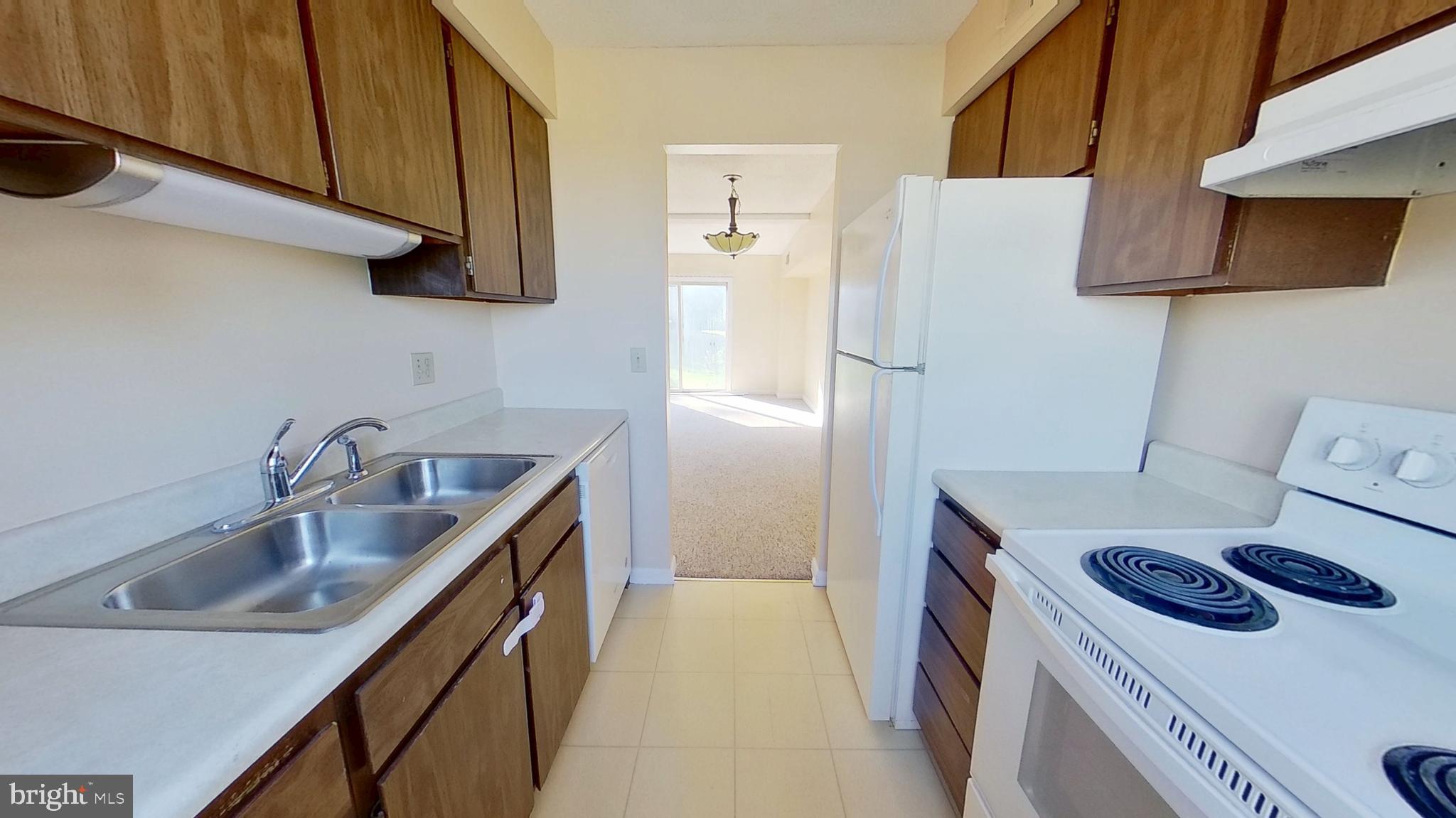 57 Beck Road York, PA 17403 - Photo 4 of 8 a kitchen with a sink a stove and refrigerator