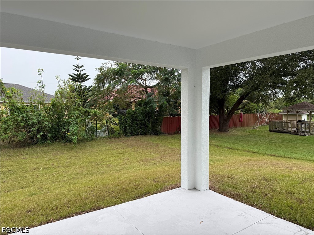 3203 24th Street Southwest Lehigh Acres, FL 33976 - Photo 14 of 19 a view of a yard with an outdoor space