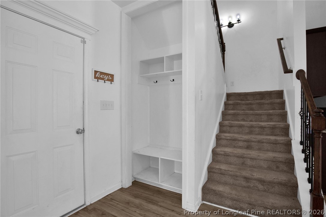 2145 Harrington Road Fayetteville, NC 28306 - Photo 25 of 50 a view of a hallway with wooden floor and entryway