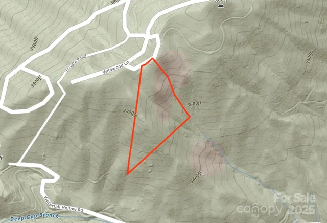 a view of a house with a mountain in the background