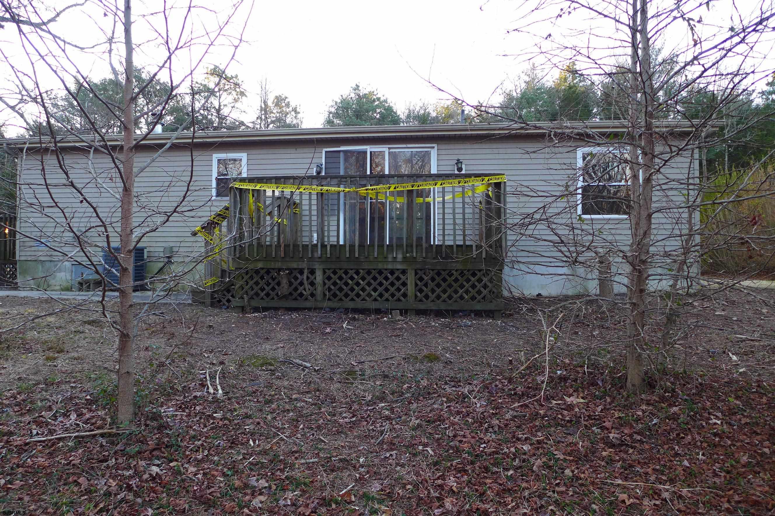 8730 Ferry Road Millville, NJ 08332 - Photo 6 of 14 a view of a house with a yard