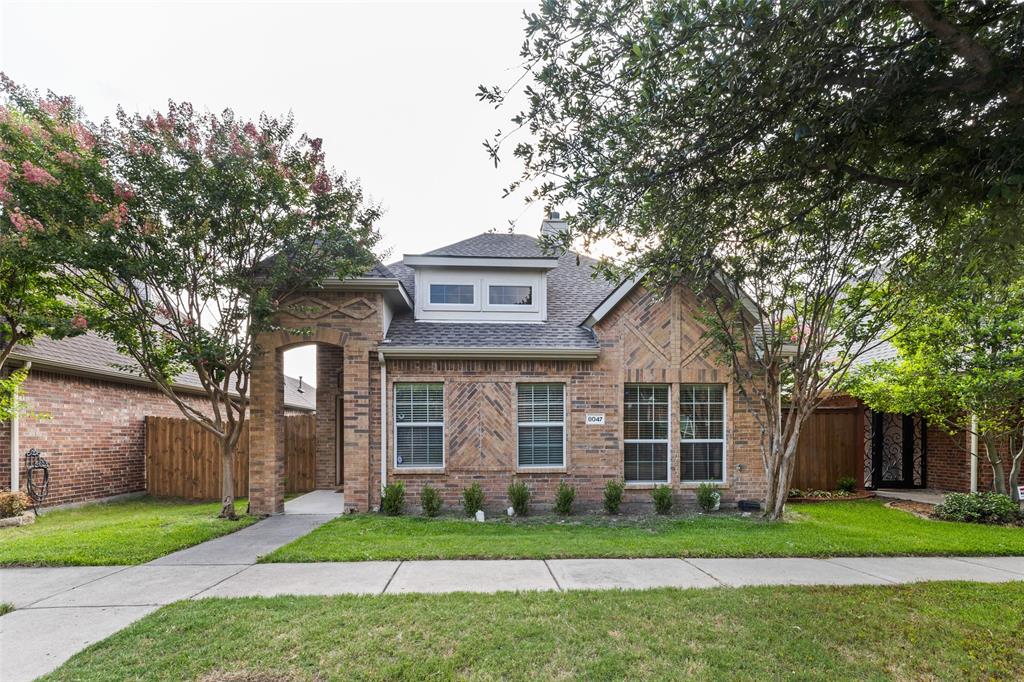 8047 New Kent Road Frisco, TX 75035 - Photo 1 of 1 front view of a brick house with a yard