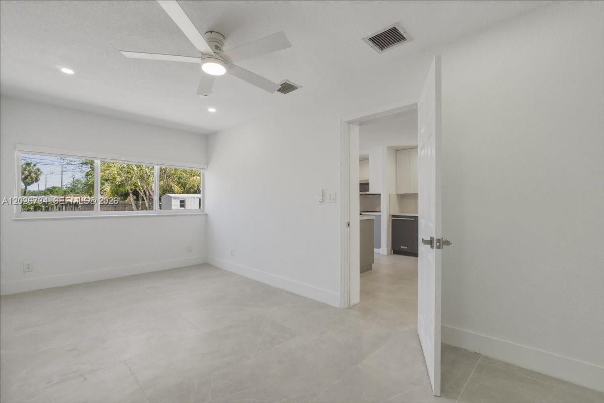 266 Southwest 6th Street Dania Beach, FL 33004 - Photo 19 of 37 an empty room with windows and closet