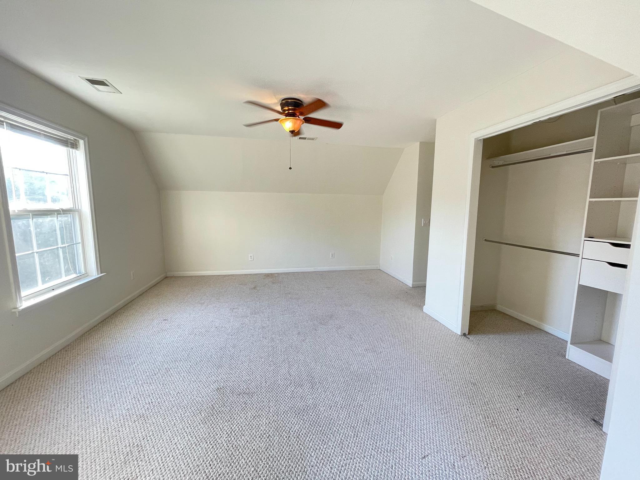 10197 Madison Drive King George, VA 22485 - Photo 14 of 19 an empty room with windows and refrigerator