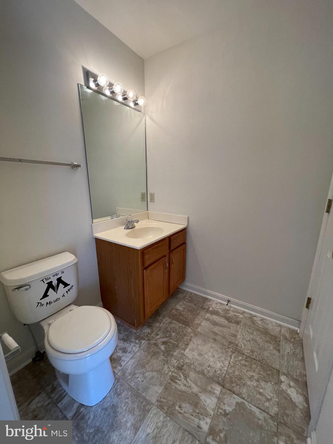 10197 Madison Drive King George, VA 22485 - Photo 9 of 19 a bathroom with a sink a toilet and mirror