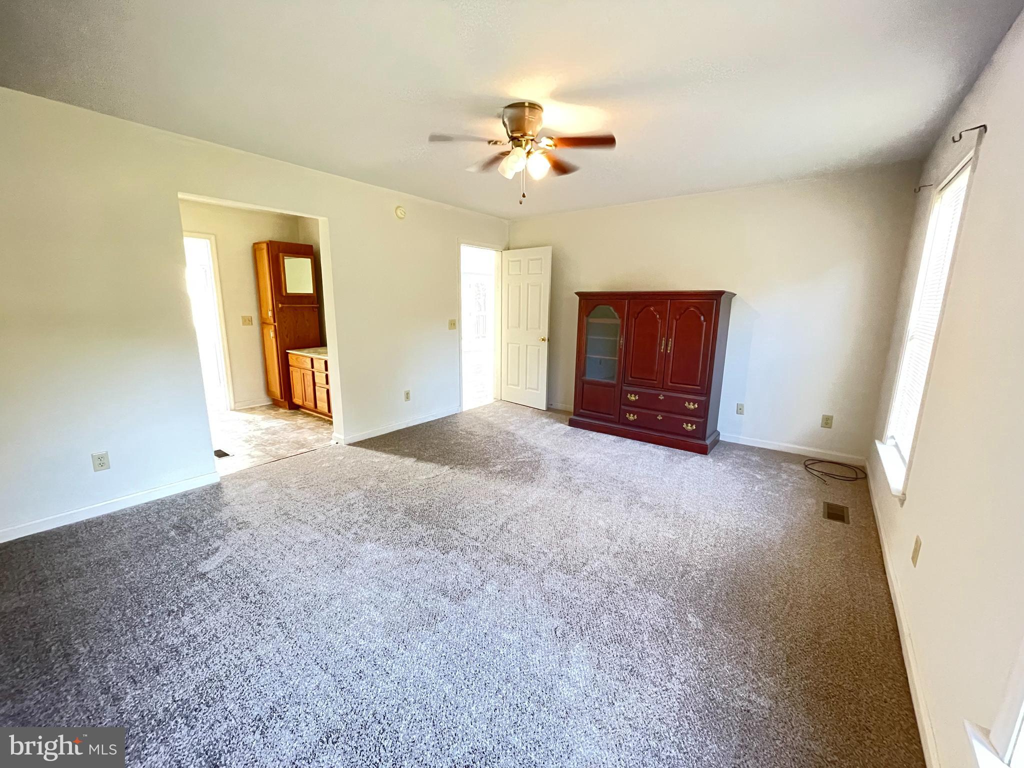 10197 Madison Drive King George, VA 22485 - Photo 10 of 19 a view of a livingroom with a ceiling fan and window