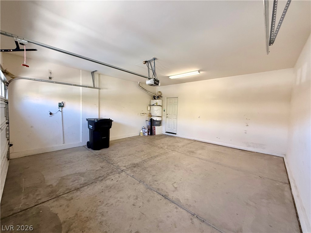 6459 Parrot Ridge Court Las Vegas, NV 89139 - Photo 14 of 23 A spacious 2 car garage offering ample storage and utility connections for convenient living.