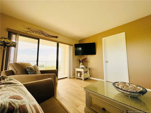 a view of a green yard next to a lake