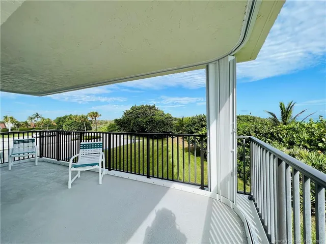 a bedroom with a bed and a lamp