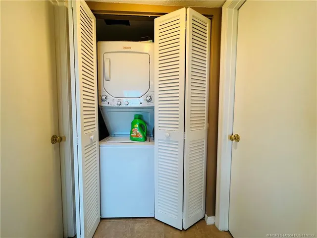 a white toilet sitting next to a bathroom sink and a shower