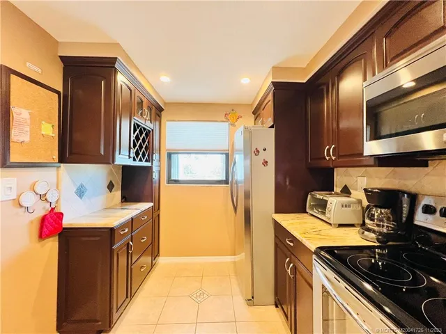 a bathroom with a sink vanity and a mirror