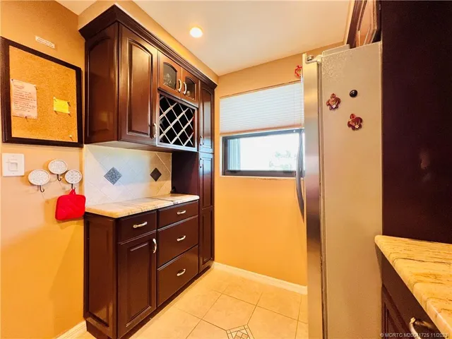 a kitchen with stainless steel appliances granite countertop wooden cabinets a stove top oven a sink and dishwasher