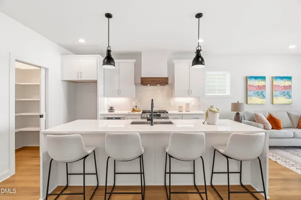 a open kitchen with sink cabinets and wooden floor