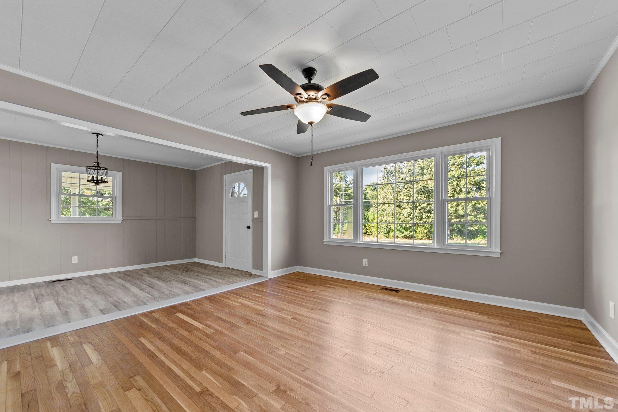 11001 Oxford Road Rougemont, NC 27572 - Photo 8 of 16 a view of an empty room with a window and a ceiling fan