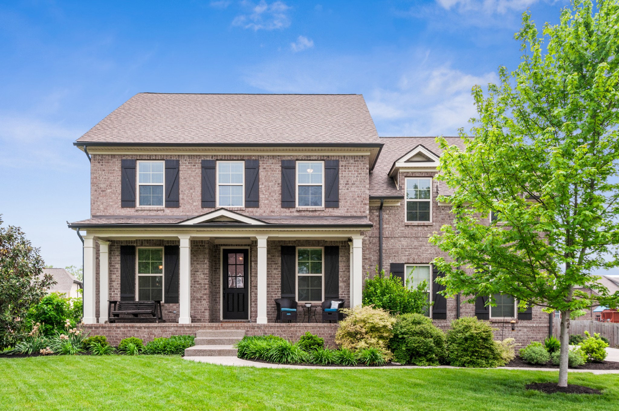 front view of a house with a yard